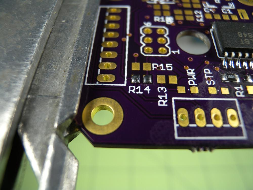 Add a small amount of solder to both pads prior to soldering the component.