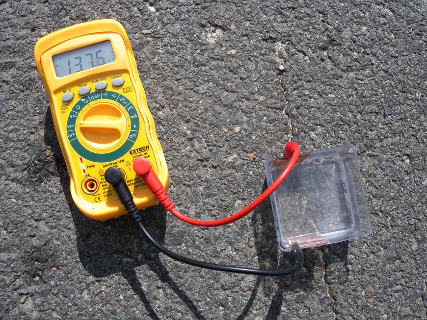 Measuring the output of the solar cell.