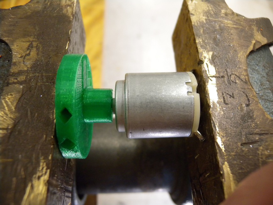 Use a vise rather than a hammer to attach the hub to the motor because the blows of a hammer will damage the motor’s internal components.