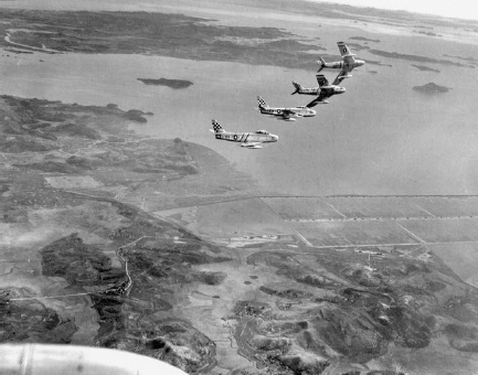 The checkerboard tail pattern indicates aircraft of the 51st Fighter Group in this photo from October 1952. NARA