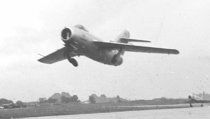 MiG taking off with an F-86 chase aircraft in background. The USAF ran extensive tests on the defecting North Korean MiG-15. HRA