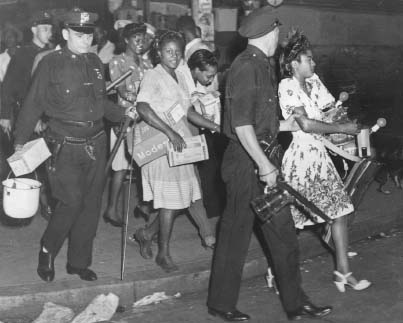 Police arrest young women during the riots in Harlem, 1943. Copyright Brown Brothers, Sterling, Pennsylvania.