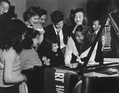 Mary Lou Williams with fans in the studios of WNEW, the radio station that hosted The Mary Lou Williams Piano Workshop, 1945.