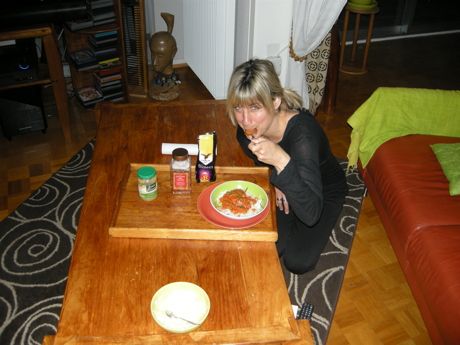 Jennifer eating her peanut sauce with rice