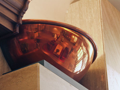 Photo depicts the spun and polished copper hemisphere light sconce.