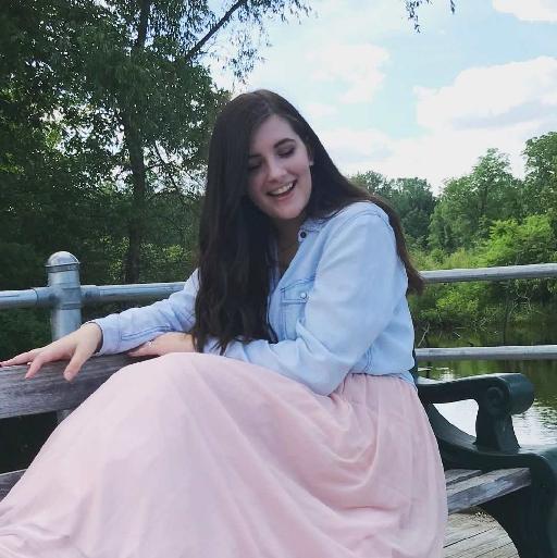 A girl sitting on a bench