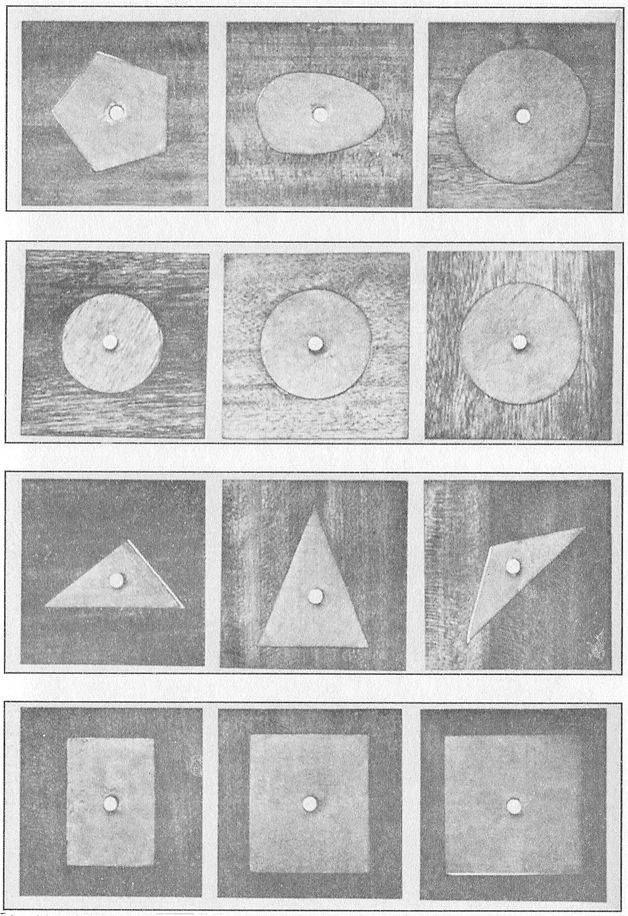 A FEW OF THE MANY GEOMETRIC INSETS OF WOOD USED TO TEACH FORM