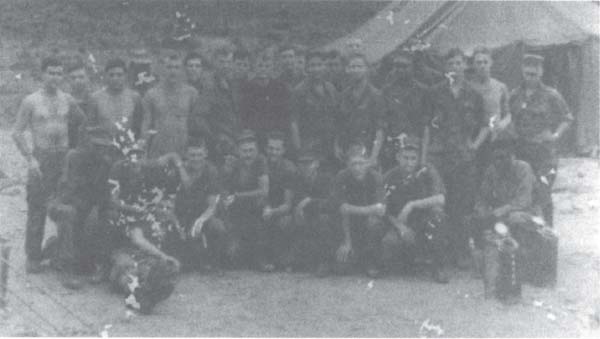 The Marines of First Platoon, Charlie Company, First Battalion, Fifth Marines, at the Phu Loc 6 firebase. This snapshot was taken a couple of days before the NVA started their mortar and rocket attacks on the combat base. January 1968. Pfc. Robert Lattimer is on the far left of the front row, kneeling. SSgt. John Mullan is kneeling, in the center, fifth from the left. L. Cpl. Ed Estes is standing behind SSgt. Mullan, dressed in a dark green sweatshirt. Ed’s friend and Marine buddy Charles Morgan is standing fifth from the left. Charlie One radio operator Benny Benwaring is standing between them, (author photo)