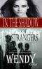 IN THE SHADOW OF STRANGERS · A wealthy man is about to change her destiny …but it’s a secret.